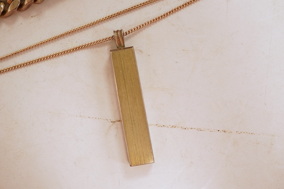 A silver necklace and bracelet, comprising: a silver ingot pendant necklace, pendant length 5.2cm including bail; and a silver curb link ID bracelet, length 20cm, each with British hallmarks, combined gross weight 82 gra